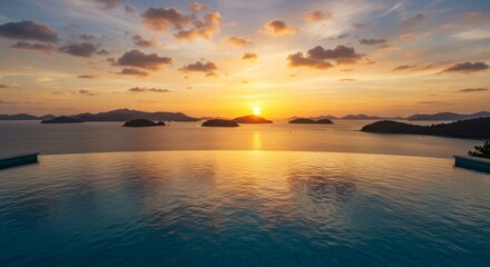 Fototapeta premium Sunset Infinity Pool Ocean View - Stunning sunset view from an infinity pool overlooking a calm ocean and distant islands. Perfect for luxury travel, vacation, and relaxation