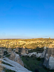Panorama view of fairy chimneys and the red valley on a beautiful sunset in Goreme, Cappadocia 