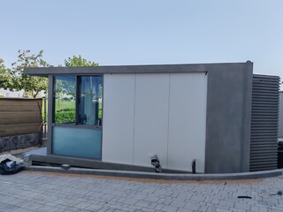 Security Booth Container with Glass Window on both side. Security Eneterence Checking Control Point Outdoor. Full View Portable container House or Home Cabin having Gray color for control Traffic.