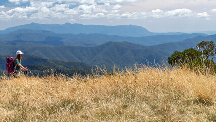Solo Female Hiker on Razorback Walking Track, Mount Feathertop &ndash; Scenic Alpine Trail in Victoria, Australia