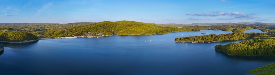 Very wide, panoramic, aerial view of the Solina Reservoir, called the Bieszczady Sea, an artificial reservoir created thanks to the accumulating waters of the San River