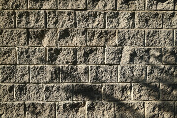 Textured Stone Wall Featuring Beautiful Natural Shadows and Unique Patterns Throughout