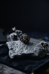 Focus on d20 die. Blurred background with monster miniatures for board games. Dice game, RPG. Dungeons  Dragons