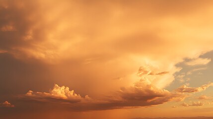 Sunset cloudscape with warm hues.