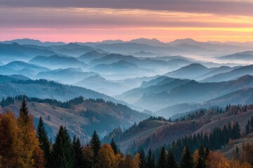 Obraz premium Serene Mountain Landscape Under Colorful Sunset Sky with Mist