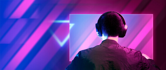 gamer playing the online game with joystick controller in neon glow dark cyberpunk room, gaming and e-sports challenge tournament streaming, streamer with analog device