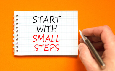Start with small steps symbol. Concept words phrase Start with small steps on beautiful white note....