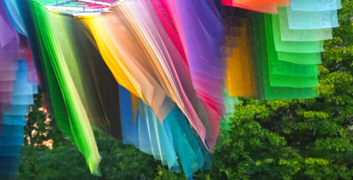 Fabric flags in rainbow color in the wind