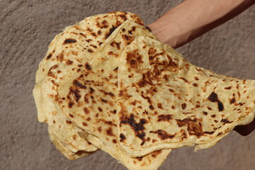 Hands Holding Moroccan Msemmen