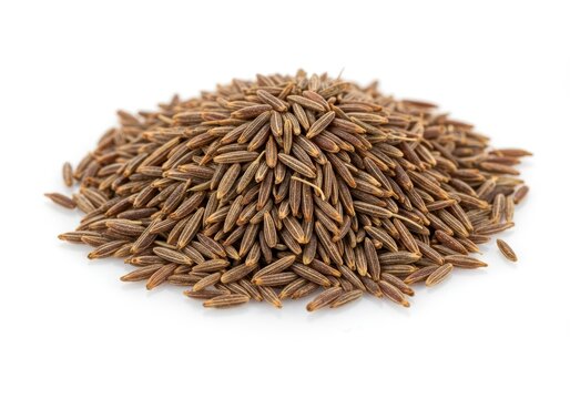 Pile of cumin seeds isolated on white background