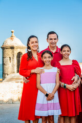 Young family of four traveling together. Family love concept. Travel concept. Cartagena de Indias.
