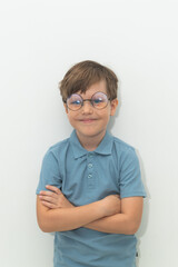 Little Boy in Blue Polo T-shirt on White Background, Child Student in Round Glasses