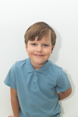 Little Boy in Blue Polo T-shirt on White Background, Child Student in Round Glasses
