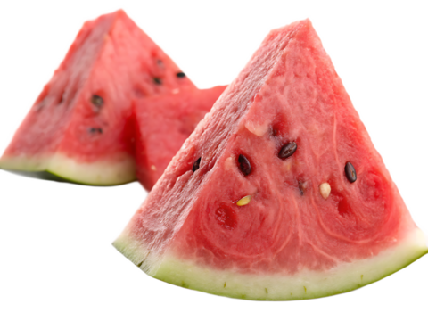 Two watermelon slices with seeds and green rind isolated on a black background close up studio shot