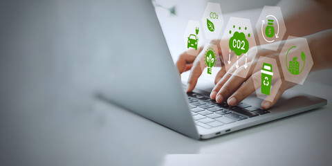 A business person using laptop with ESG environment social governance investment business concept, co2 on visual screen.