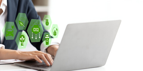 A business person using laptop with ESG environment social governance investment business concept, co2 on visual screen.