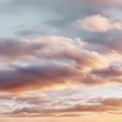 Fototapeta premium soft pastel sunrise clouds with plenty of copy space in the center, minimalistic background