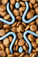 Slow feeding bowl filled with dry food closeup
