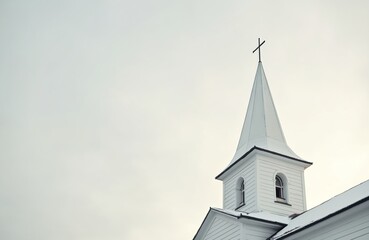 Low angle shot of white church building with cross on top. Architecture, steeple, sky, religion, travel, christianity concept. Iconic place, symbol of faith, place worship, spiritual meeting point,
