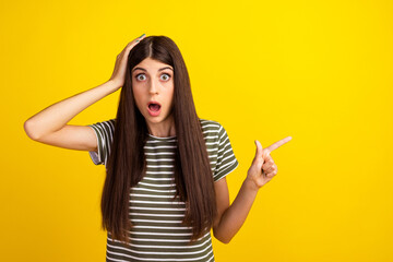 Photo of young student girl open mouth direct finger side empty space bad awful news hold arm on...