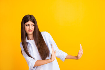Photo of young serious woman raise hands to empty space see disgusting situation ugh isolated...