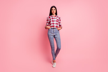 Full body portrait of smiling brunette isolated on pink color background