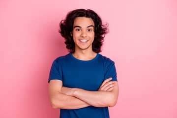 Fototapeta premium Photo of young guy holding hands crossed together isolated pink color background