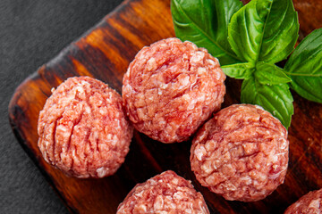 Meatballs raw meat pork, beef, chicken fresh delicious gourmet food background on the table rustic food top view copy space
