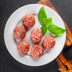 Meatballs raw meat pork, beef, chicken fresh delicious gourmet food background on the table rustic food top view copy space