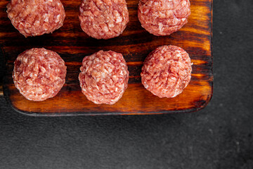 Meatballs raw meat pork, beef, chicken fresh delicious gourmet food background on the table rustic food top view copy space