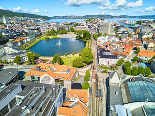 Aerial drone view of the center of Bergen with small lake and tram, Norway