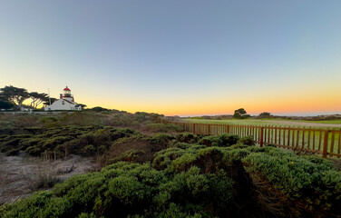 Lighthouse Trail at Twilight with Full Moon and Cypress Tree, Pacific Grove Golf Links on the Right, Monterey Bay, California. Point Pinos Lighthouse. 