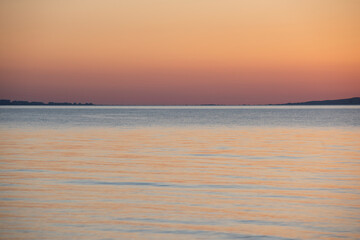 Obraz premium Sunset in the Sea of Azov, calm water