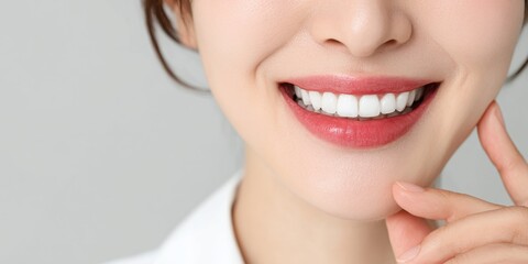 Smiling woman showcasing bright teeth in a studio portrait photography clean and elegant environment
