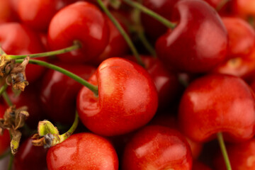 shot captures a generous pile of fresh, ripe cherries, highlighting their vibrant red hues and natural texture. Perfect for food photography, healthy recipes, or farmers' market promotions
