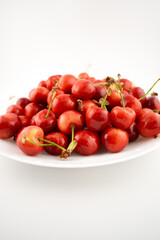This delightful shot captures a generous pile of fresh, ripe cherries, evoking pure natural sweetness and seasonal joy. Perfect for food photography, healthy recipes, or farmers' market promotions