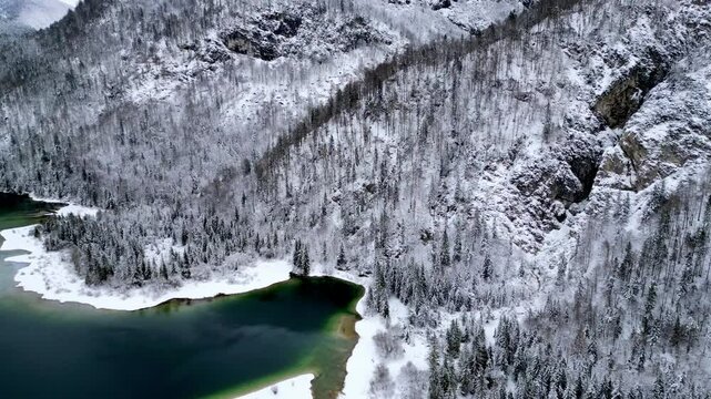 Predil Lake. Winter on the lake, a gem nestled in the Julian Alps.