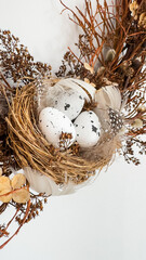 Wielkanoc, kartka świąteczna, gniazdo z pisankami, wianek świąteczny, dekoracje wielkanocne. Easter, easter decorations, poster.
