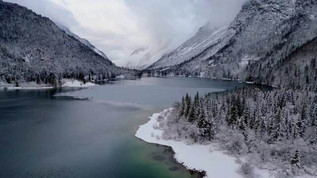 Predil Lake. Winter on the lake, a gem nestled in the Julian Alps.