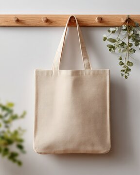 Beige Canvas Tote Bag on Wooden Wall Hanger