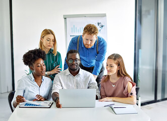 Fototapeta premium Group of young business people using laptop having a meeting or presentation and seminar in the office