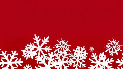 A winter wonderland of white snowflakes against a bright red background, creating a festive and cheerful holiday scene. Ideal for seasonal cards, wallpapers, and digital designs. - Powered by Adobe