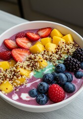Rainbow Fruit and Quinoa Smoothie Bowl - Vibrant smoothie bowl with layers of fresh strawberries, mango, blueberries, raspberries, blackberries, and quinoa