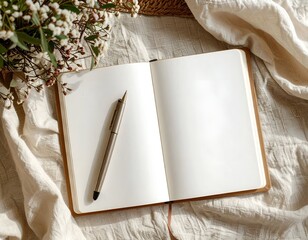 Open Journal with Pen on White Cloth, Top View with Green Plants