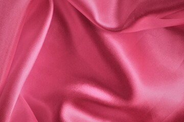 close up of pink satin fabric texture background with copy space for design
