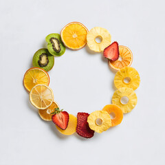 Colorful dried fruit slices wreath with empty white center.