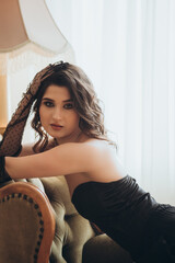 Sensual Close-Up of Woman in Black Dress and Gloves
