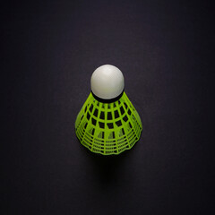 A badminton rocket isolated on dark playground with copy space, Sports concept photography single...
