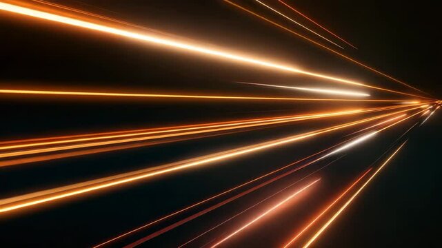 Abstract light trails in the form of orange and gold stripes, creating the effect of speed and movement on a dark background