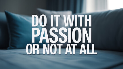Motivational quote on a couch with blue pillows in a softly lit room